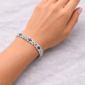 Hand wearing a silver bracelet.