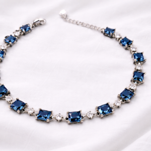 Elegant blue gemstone necklace on fabric